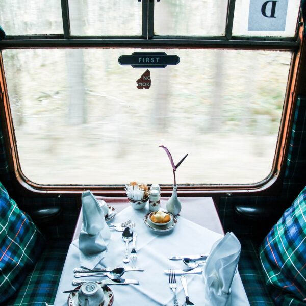 dinner table next to a window inside luxury sleeper train