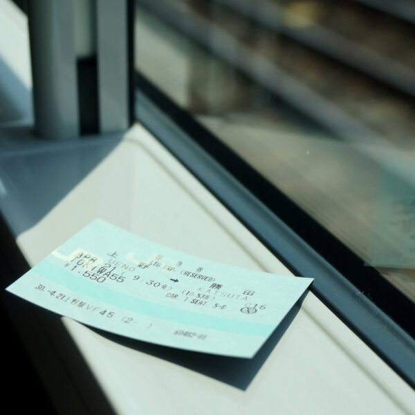 japanese bullet train tickets on a windowsill