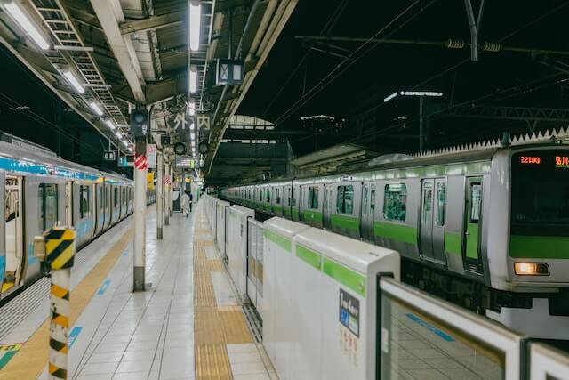 empty underground Tokyo subway station with train waiting