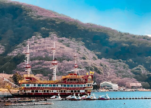 Pirate ship in Hakone with cherry blossoms in background