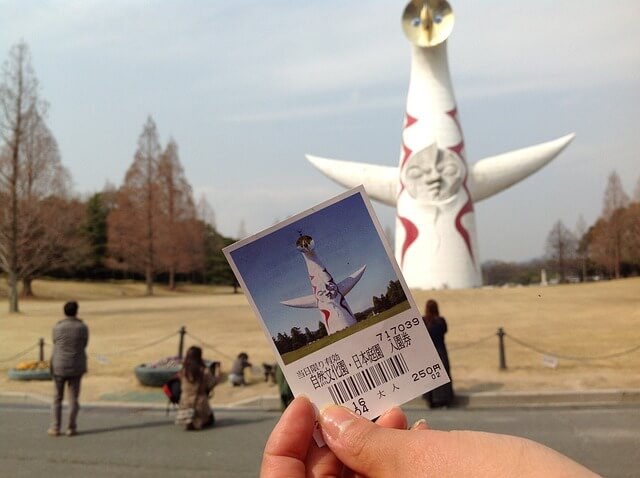 Tall white human-bird-like tower in Osaka's expo 70 commemorative park